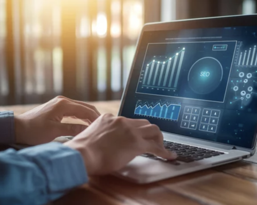 businessman using a laptop to analyze SEO metrics, focusing on promoting website ranking and optimizing traffic, with the inscription "SEO" displayed